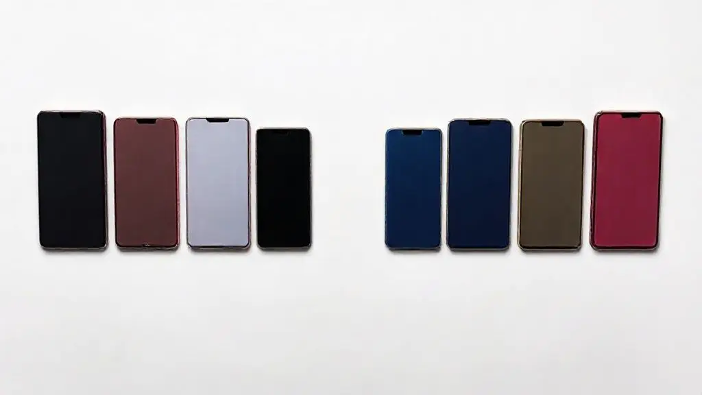 Uma fileira de vários modelos de iPhones modernos e coloridos, representando as melhores opções de custo-benefício para comprar em 2025.